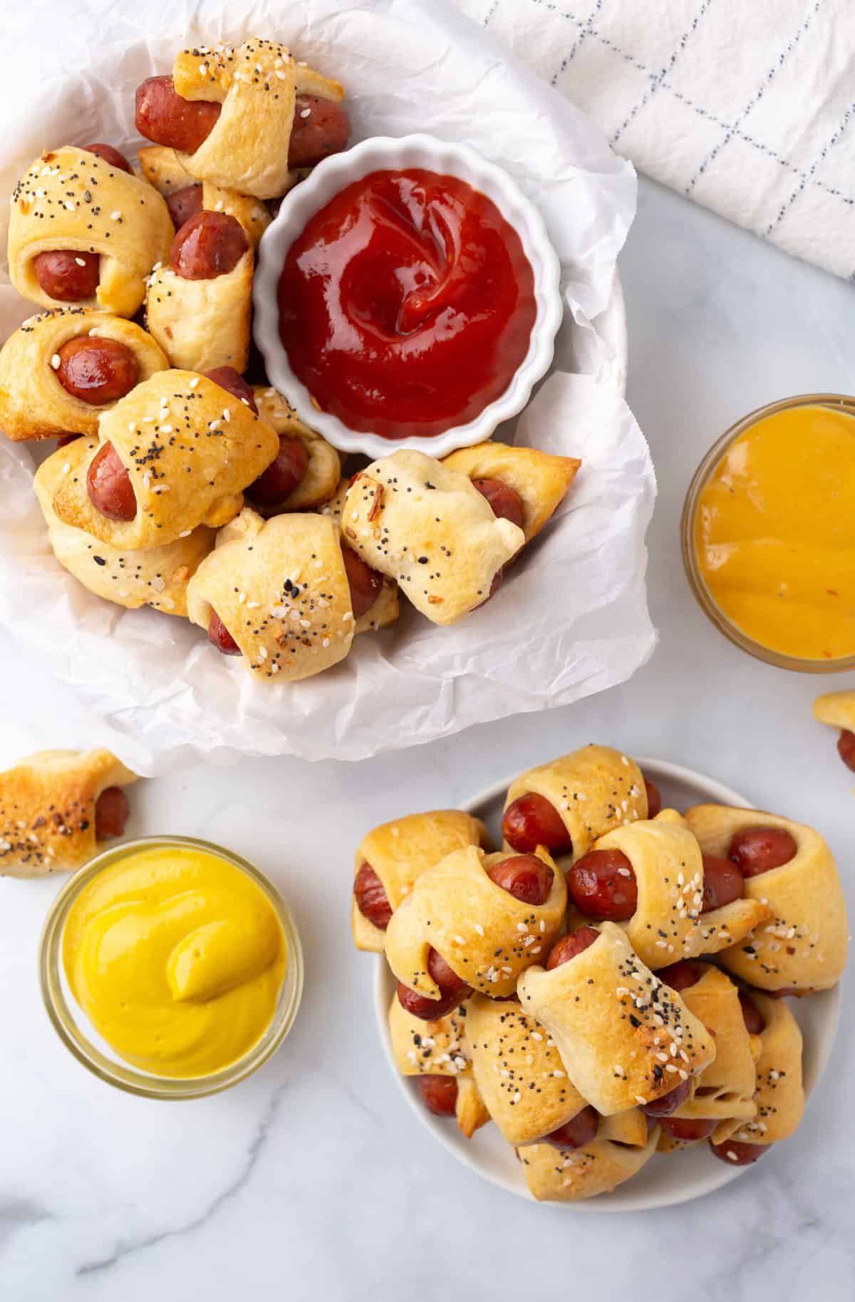 pigs in a blanket served in a basket and served on a plate