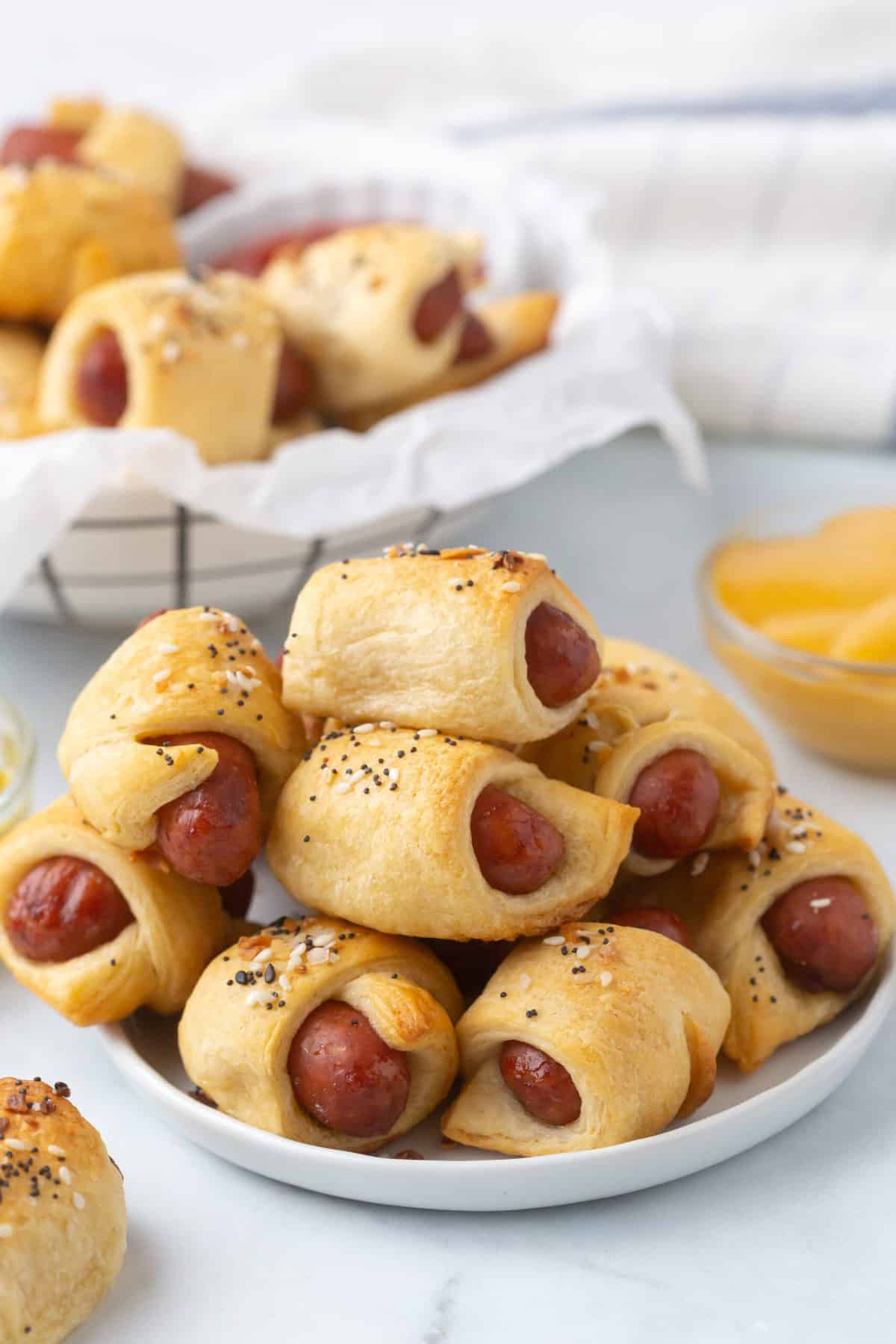 a bunch of baked pigs in a blanket served on a plate