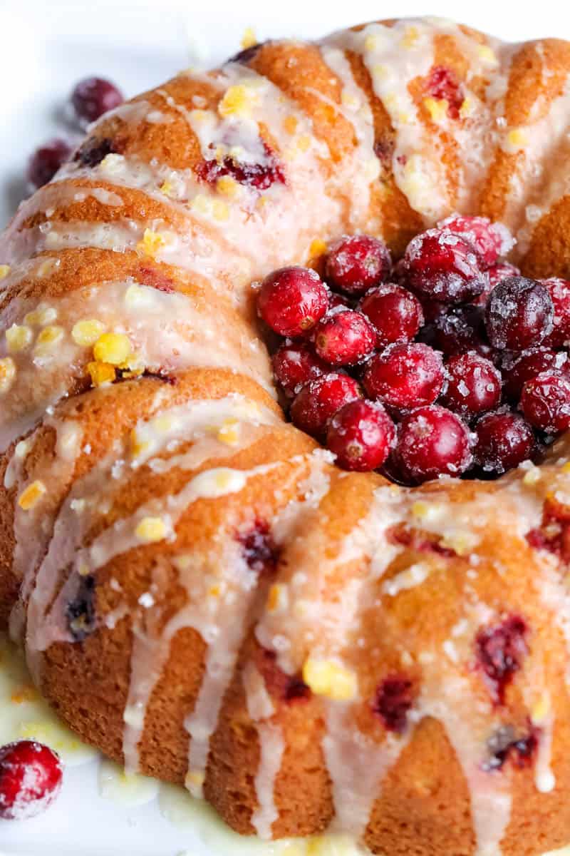 cranberry orange bundt cake with sugared cranberries in the middle