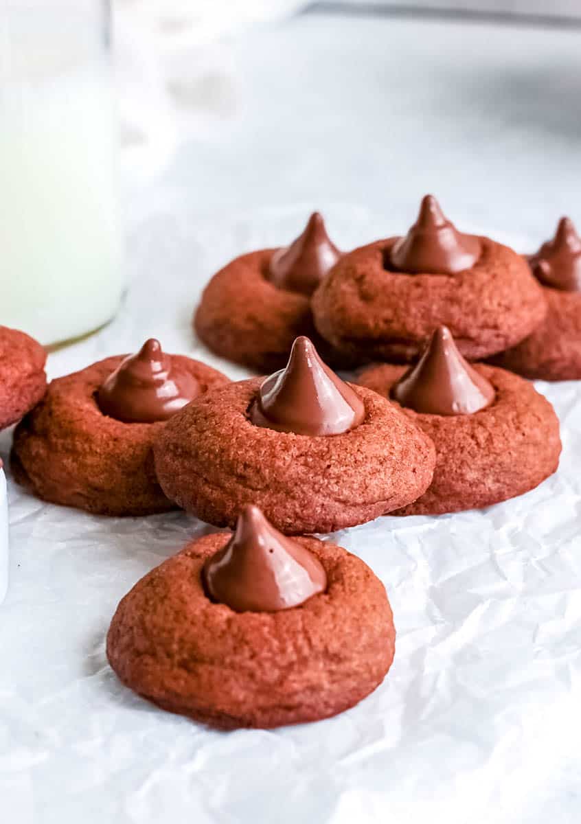 hot chocolate blossom cookies stacked on parchment paper