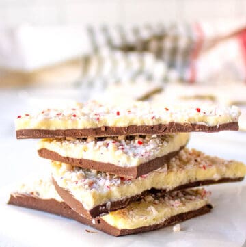 Four pieces of peppermint bark stacked on top of each other.