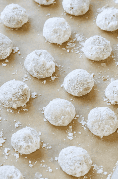 snowball cookies on parchment paper