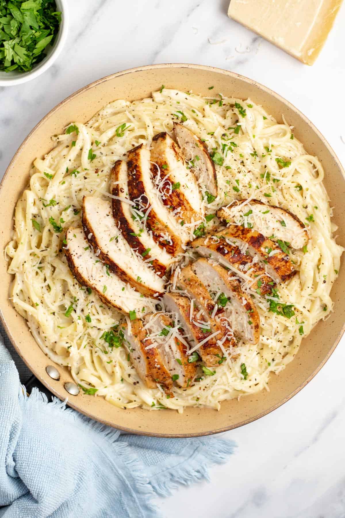 Homemade chicken fettuccine alfredo in skillet.