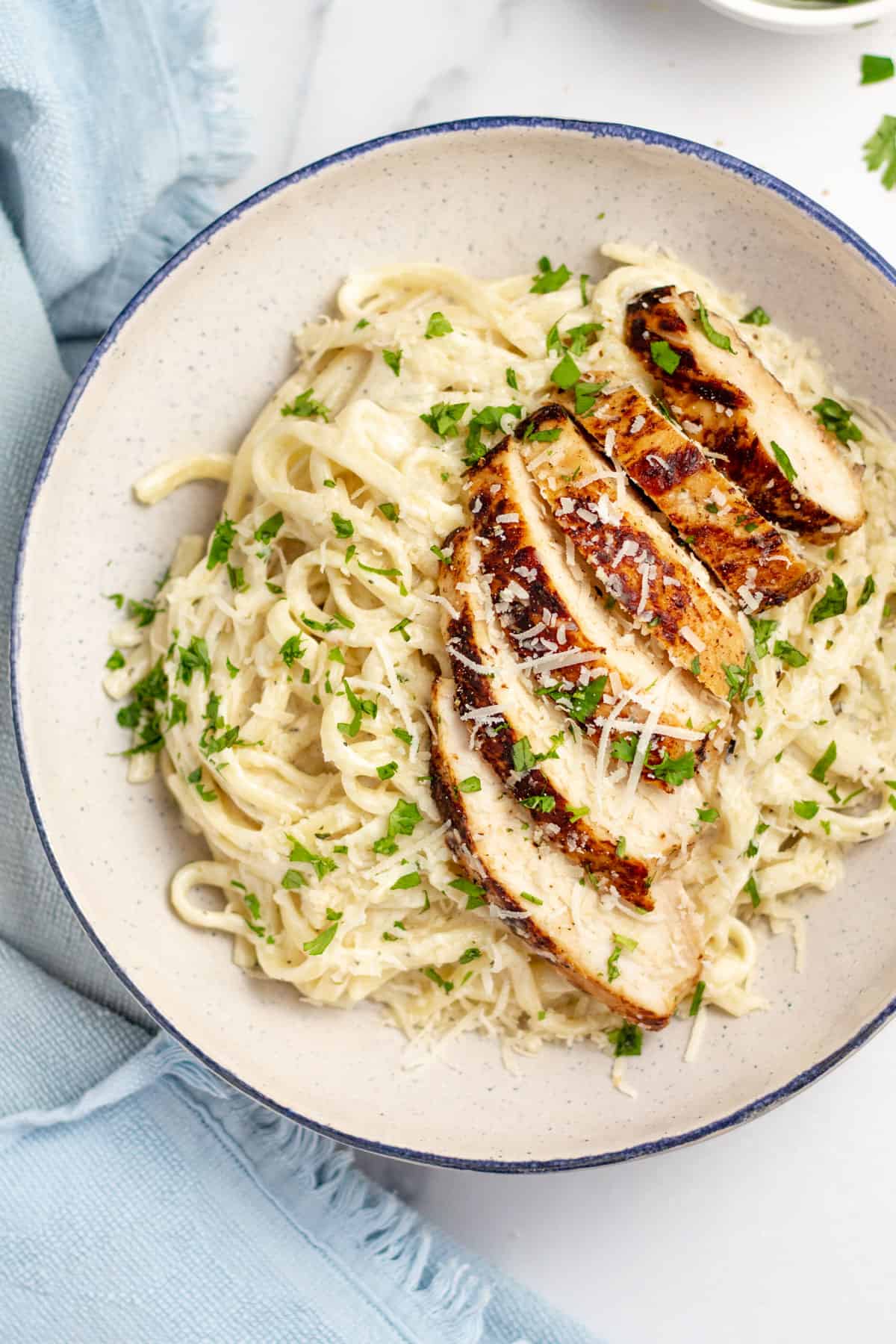 Plate of homemade chicken fettuccine alfredo.