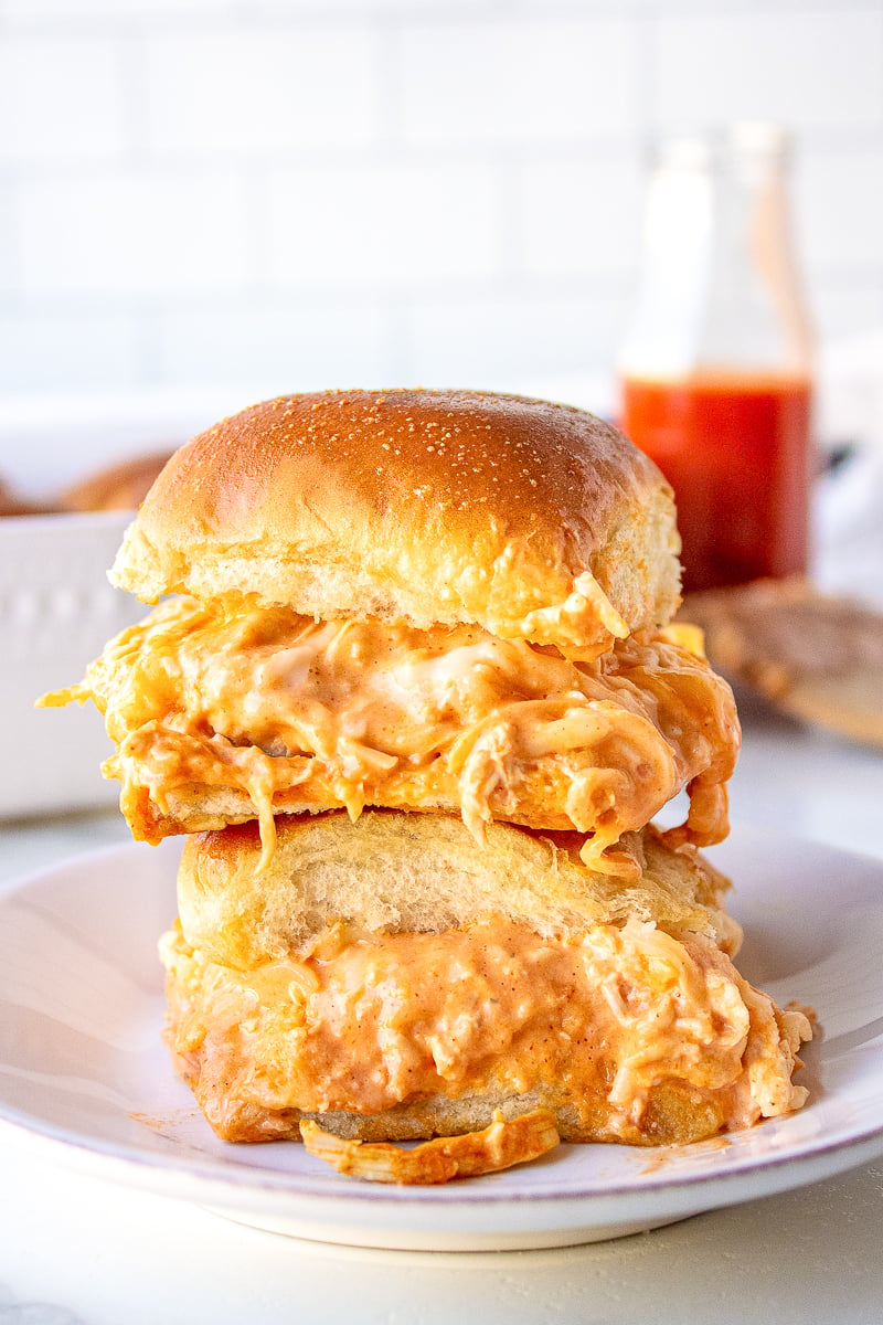 two buffalo chicken sliders stacked on a plate