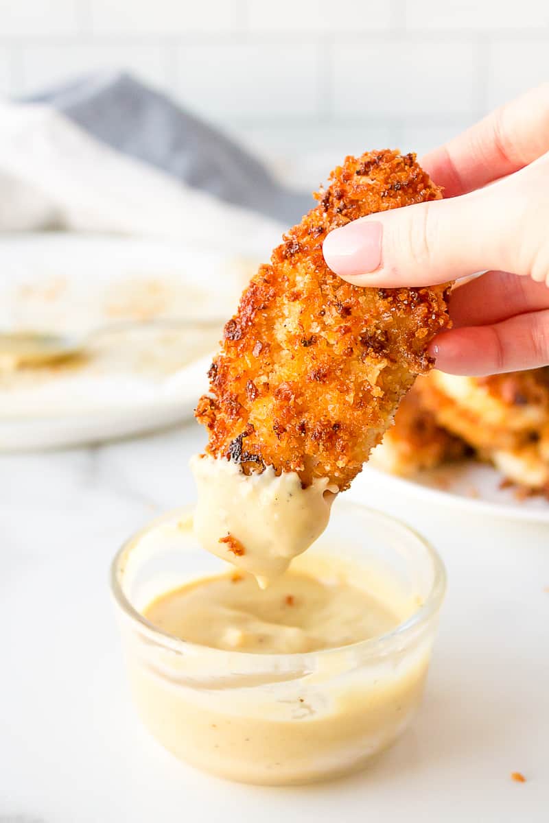 crispy chicken strips with a honey mustard dipping sauce