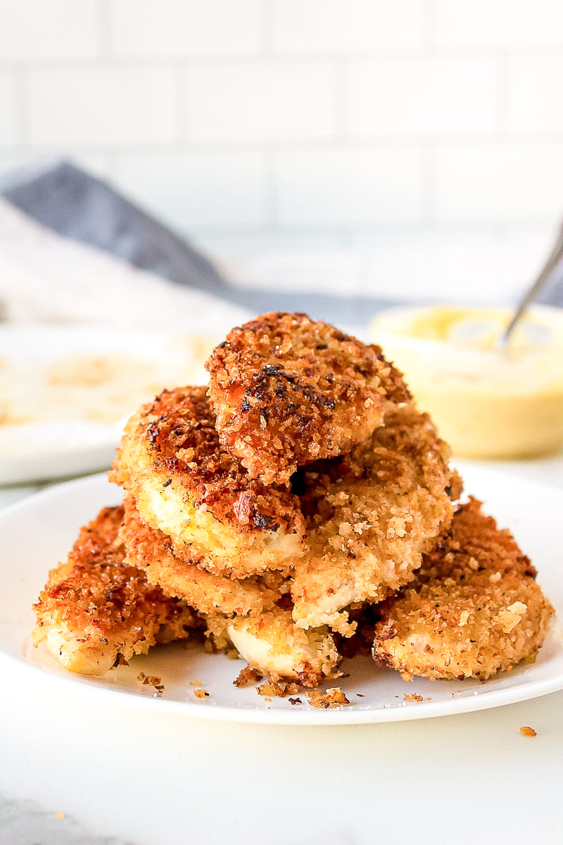 crispy chicken strips stacked on a plate