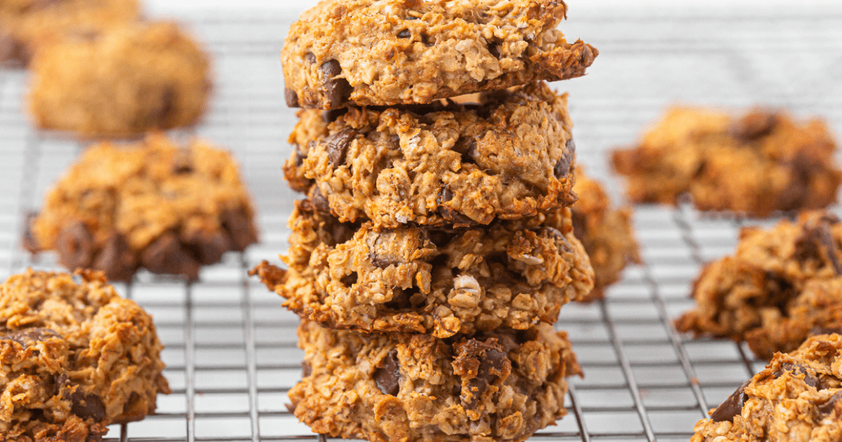 four stacked oatmeal banana cookies on a cooling wire rack