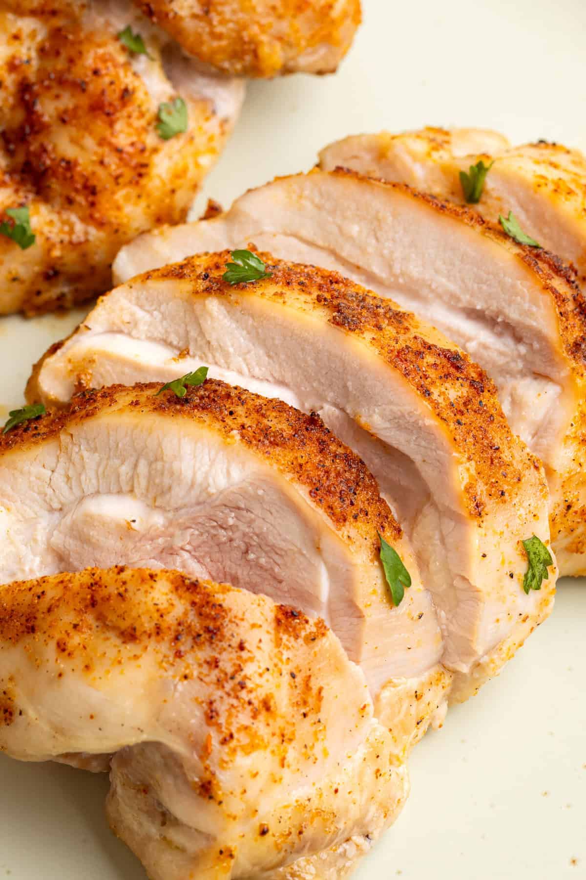 Sliced air fryer boneless skinless chicken thigh.