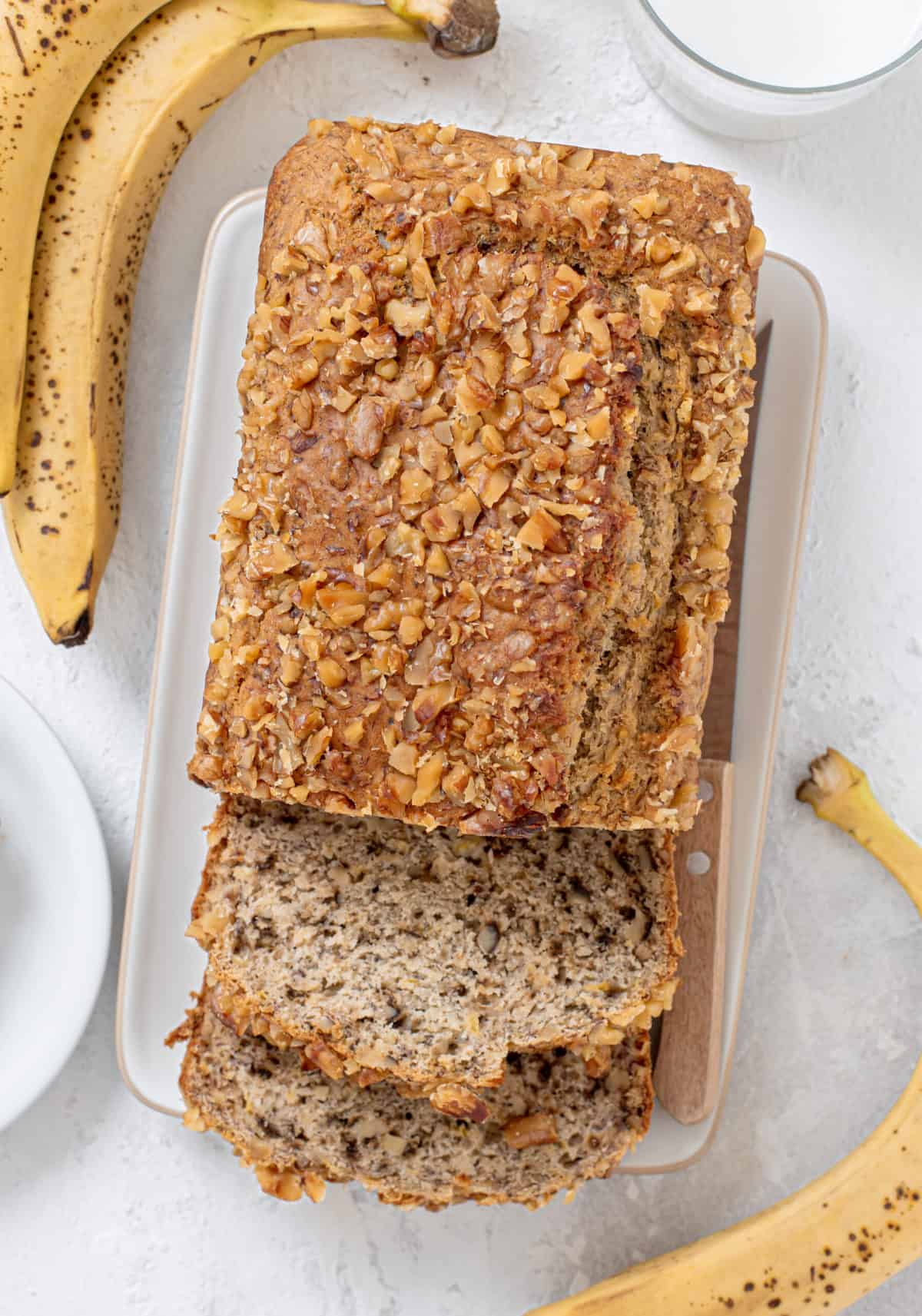 banana walnut bread loaf with two slices cut