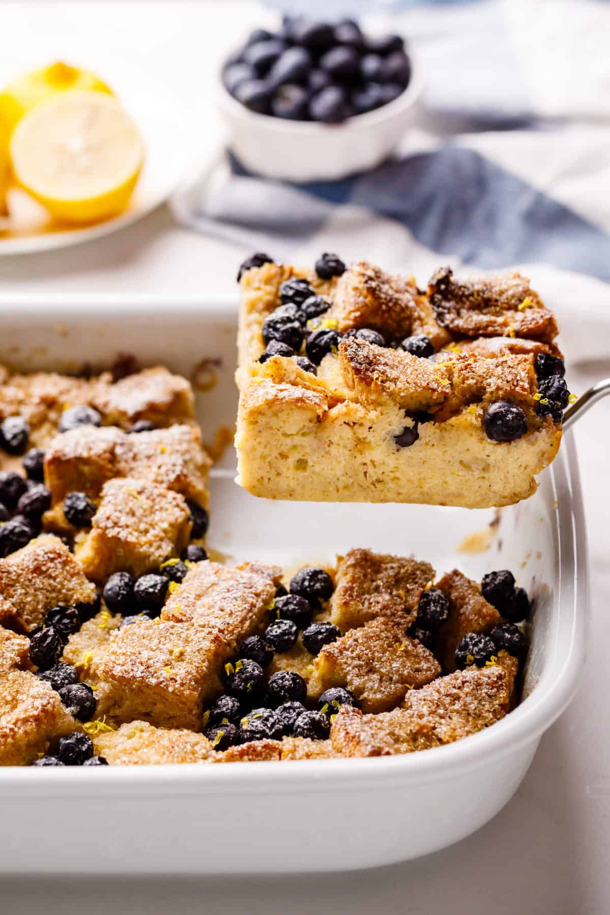 square slice serving of blueberry french toast casserole on a metal spatula