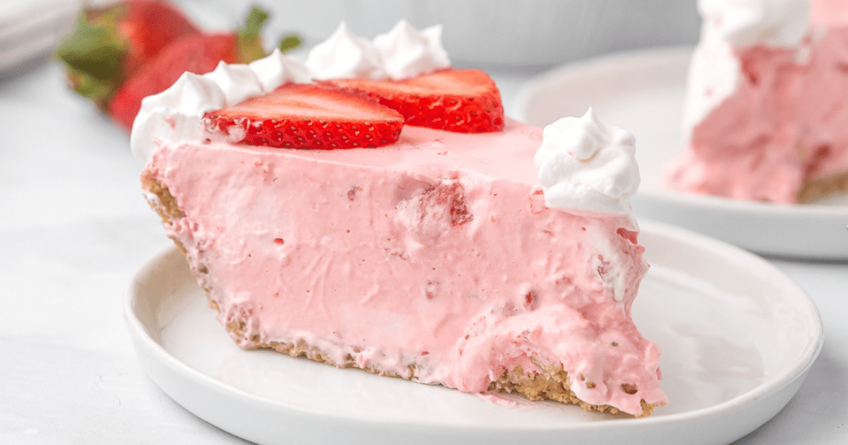 A slice of strawberry jello pie on a plate. 
