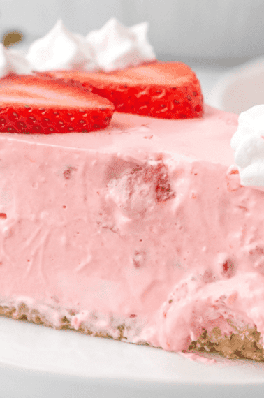 A slice of no bake jello strawberry pie on a plate.