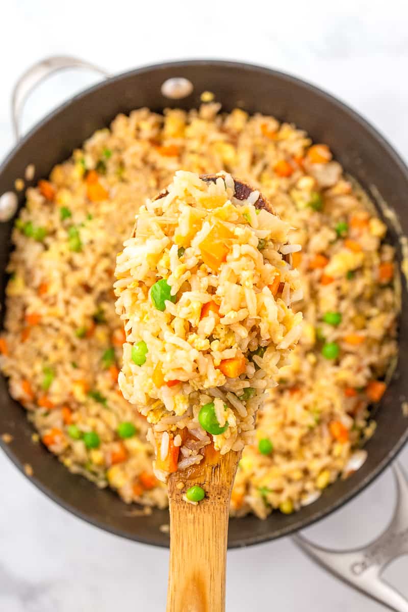 fried rice on a wooden spoon
