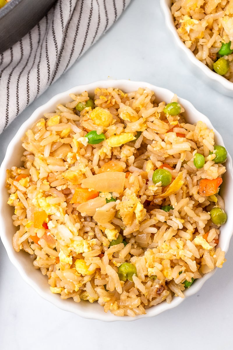 homemade vegetable fried rice served in a white bowl