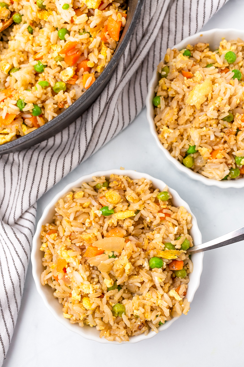 homemade fried rice with vegetables served in a white bowl