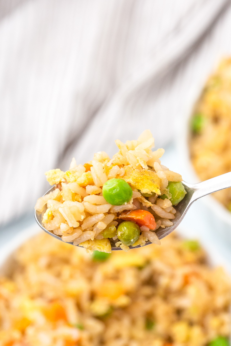 vegetable fried rice on a silver spoon