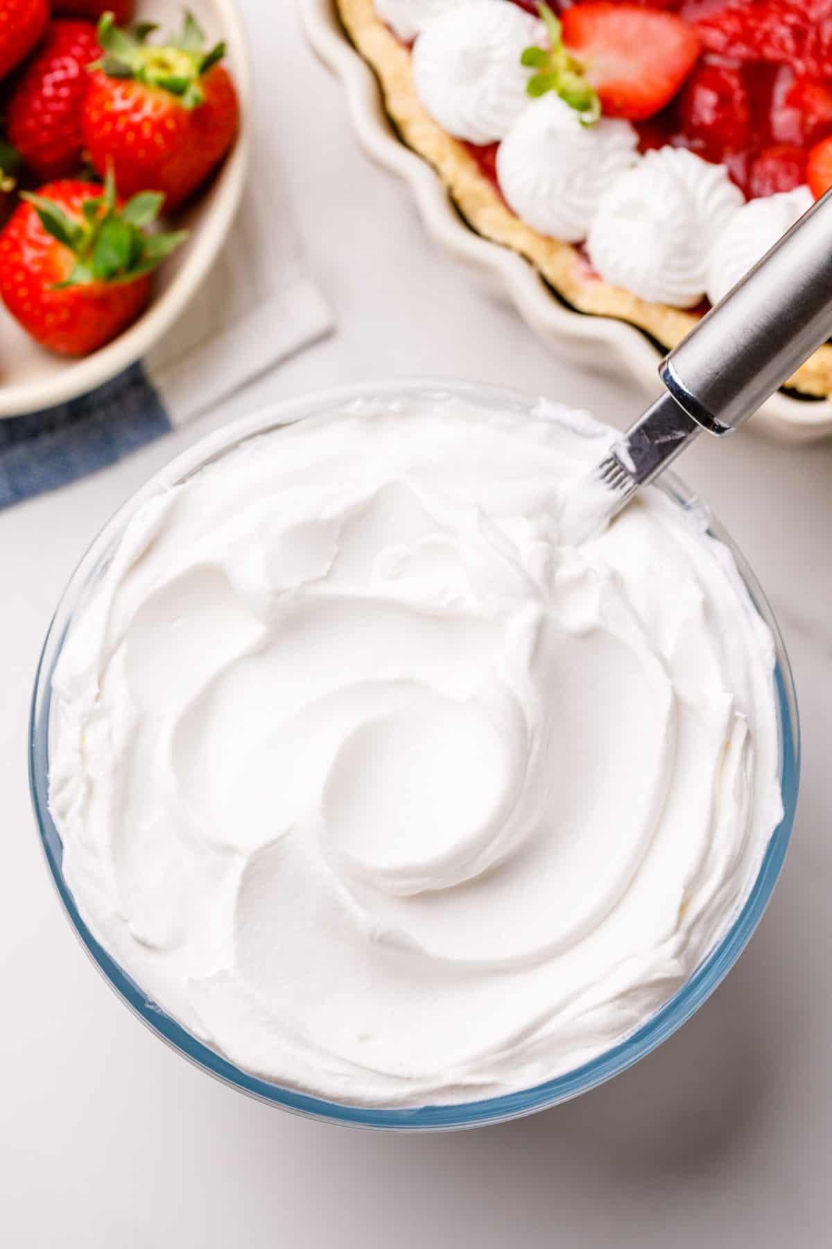 whipped cream aka chantilly cream in a glass bowl