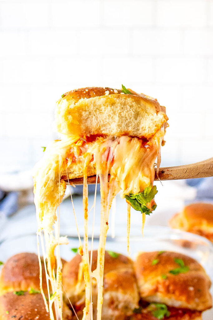 pizza slider dished out with cheese pull 