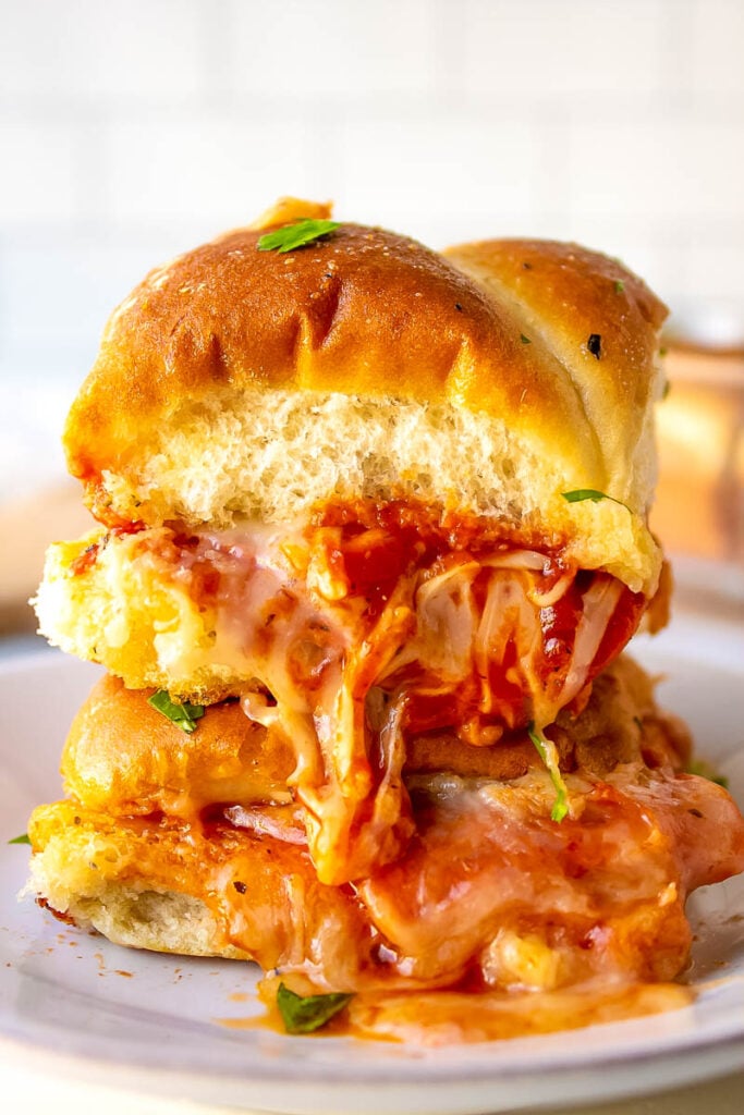 pizza sliders on a plate stacked 