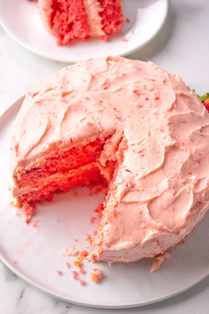 strawberry layer cake on a white plate 