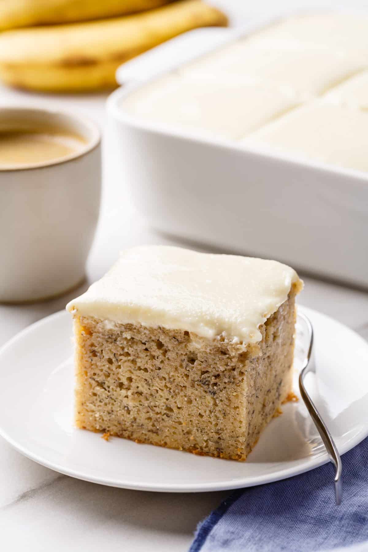 a piece of banana cake on a white plate