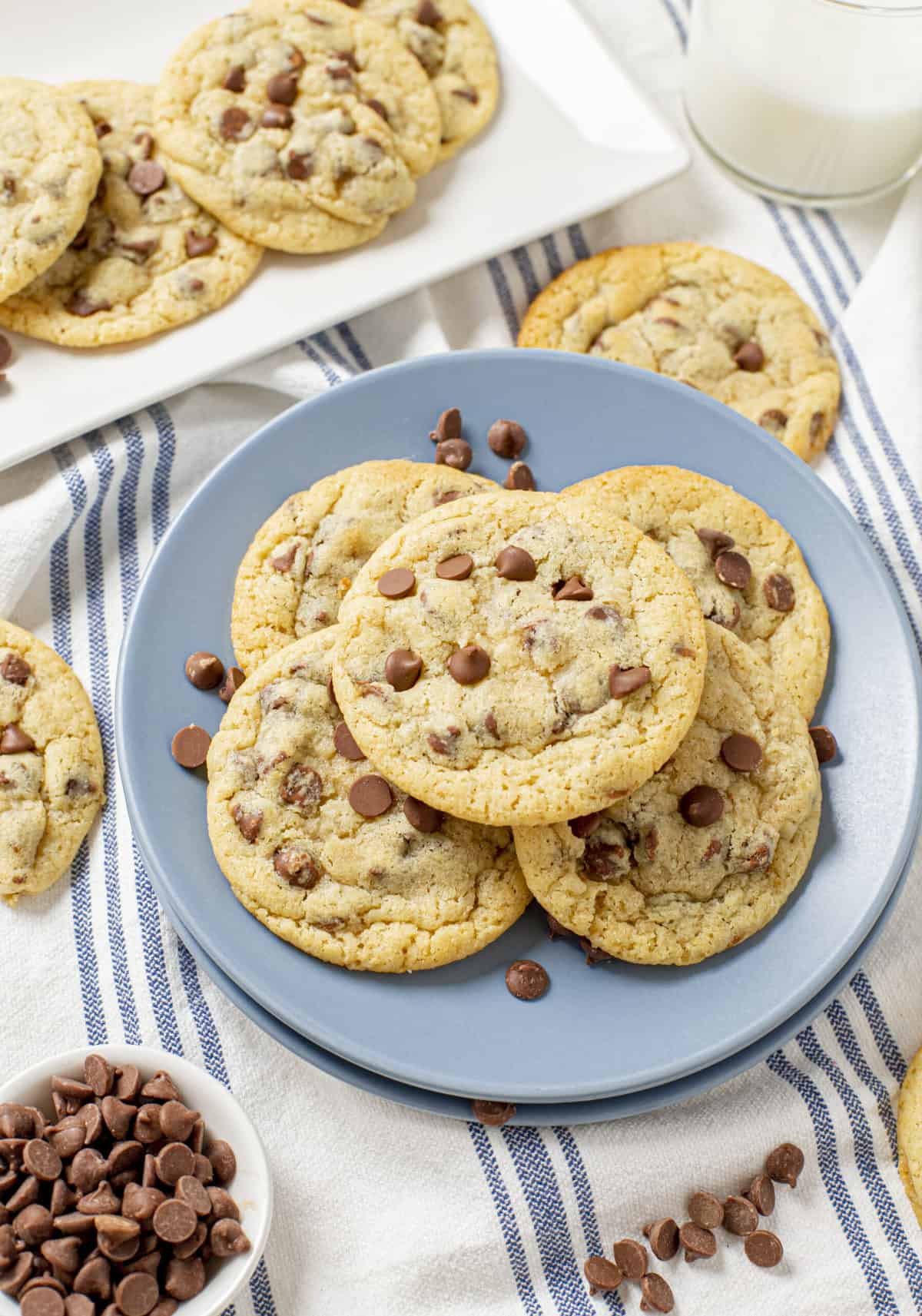 plate of five super chewy chocolate chip cookies served on a blue round plate