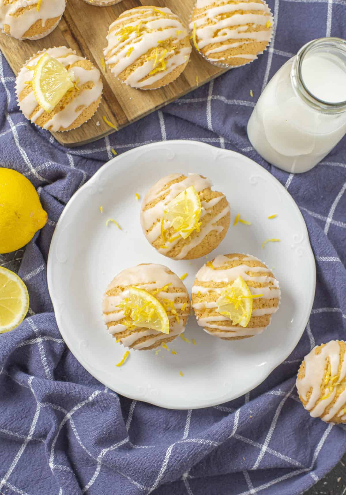 three lemon muffins on a white plate