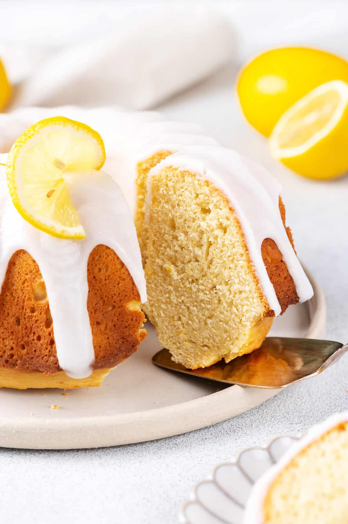 lemon pound cake with lemon glaze sliced to show the cross section