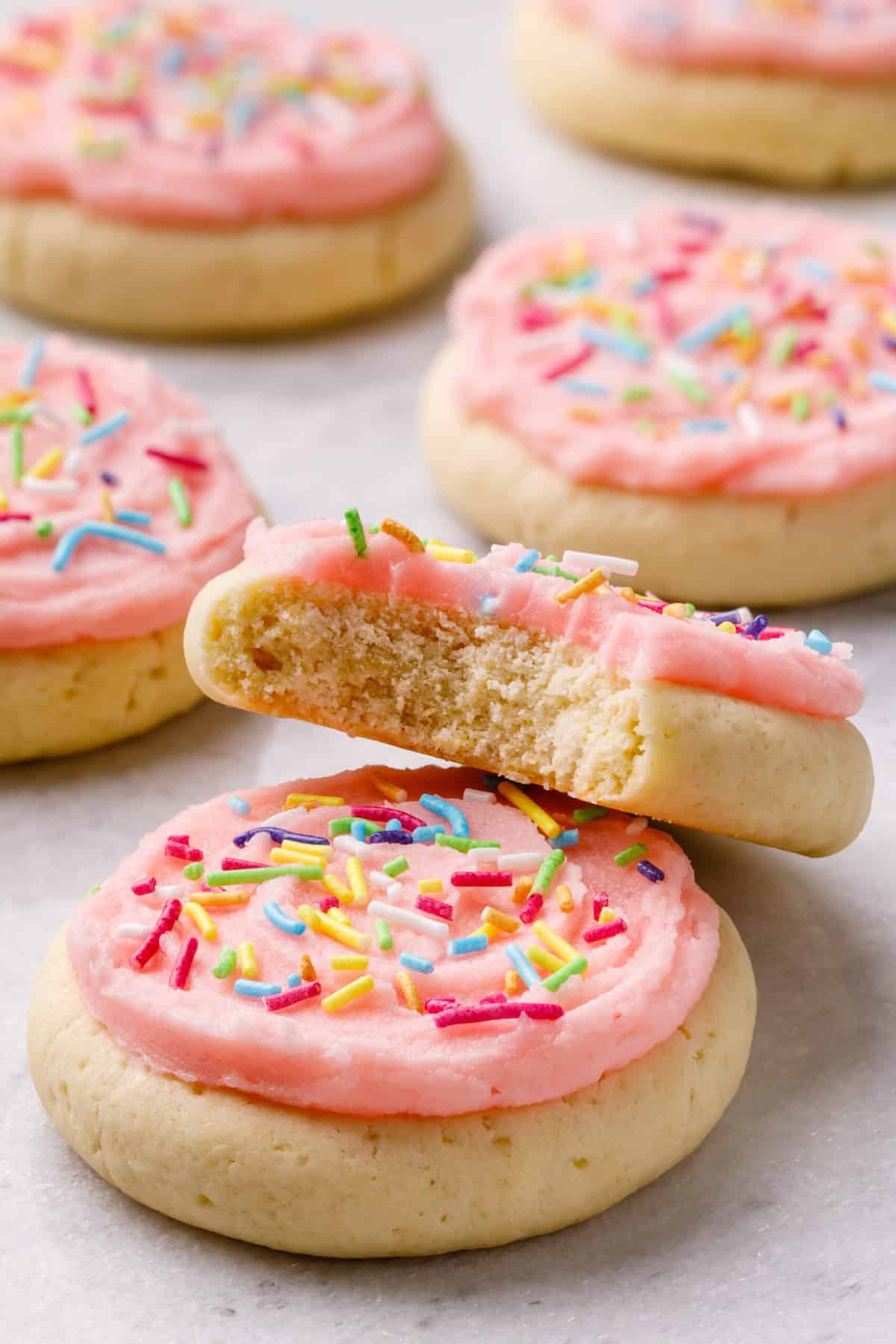 copycat lofthouse cookies with pink frosting and sprinkles