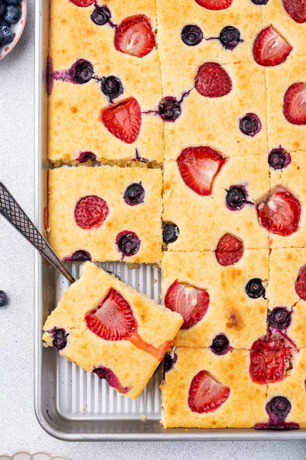 top down image of sheet pan berry pancakes. 