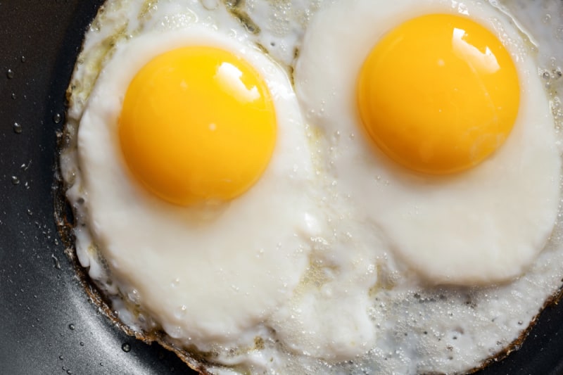eggs in black frying pan