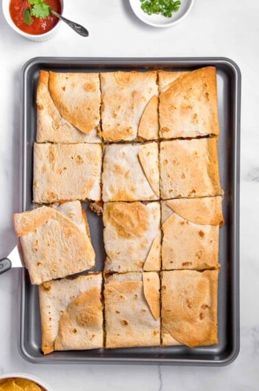 Sheet pan quesadillas cut into squares.