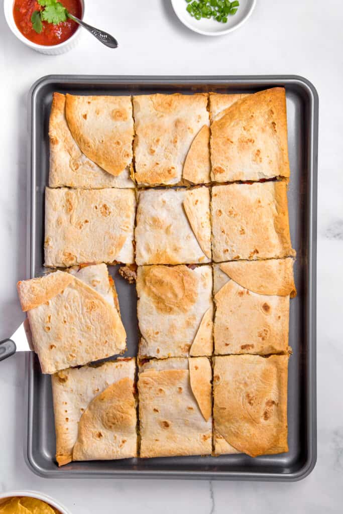 Sheet pan quesadillas cut into squares.