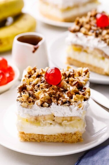 A slice of banana split cake on a plate.