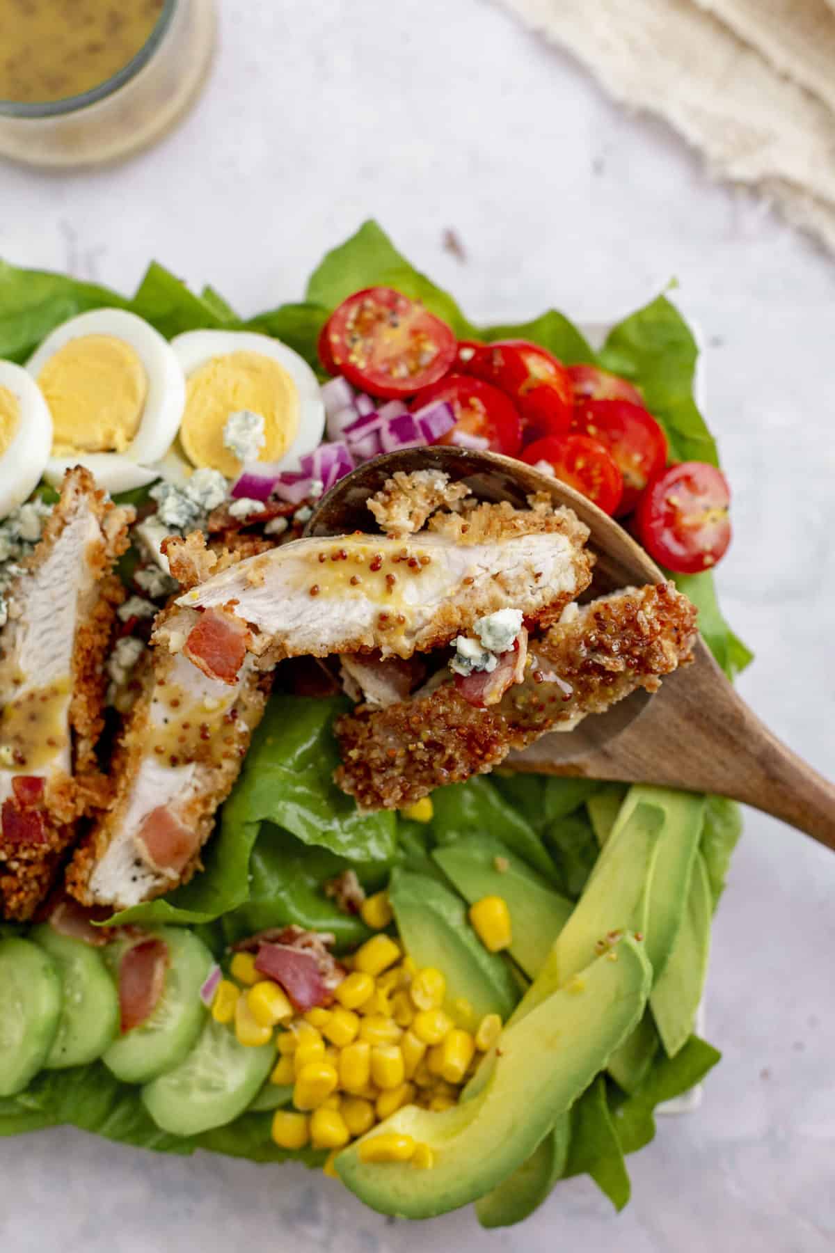 Crusted Chicken Cobb Salad with a spoonful of crusted chicken