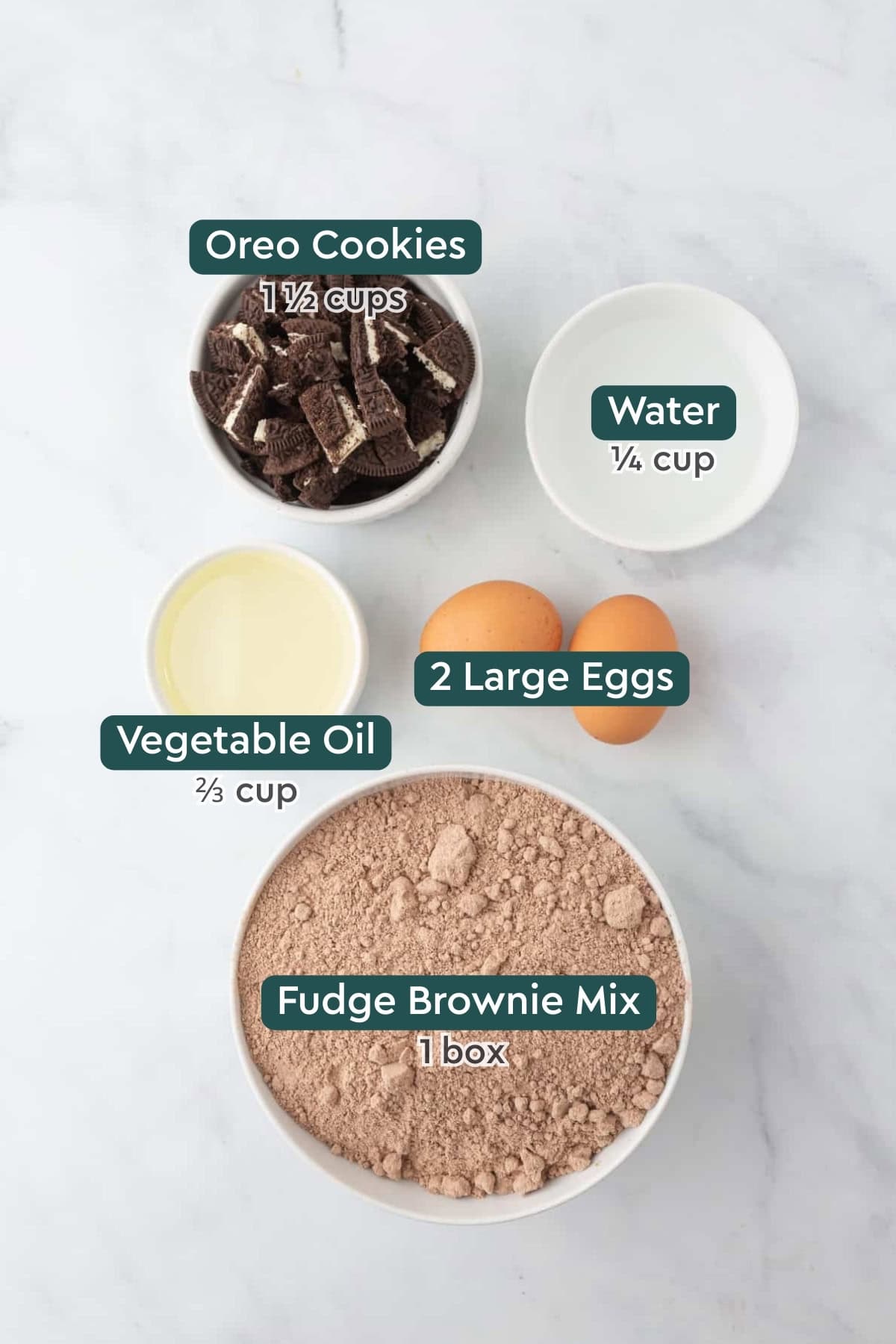 Ingredients for Oreo brownies, including Oreos, water, eggs, oil, and brownie mix.