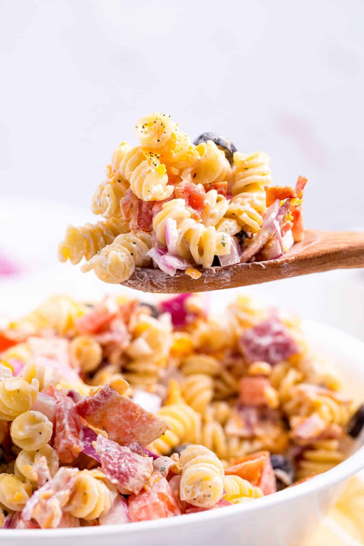 wooden spoonful of bacon ranch pasta salad