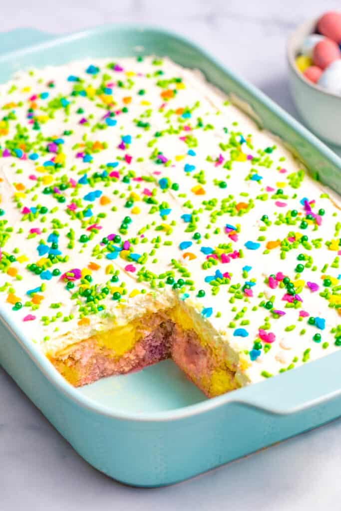 easter poke cake in a blue dish 