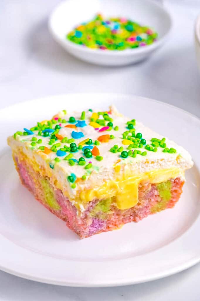 piece of easter poke cake on a white plate