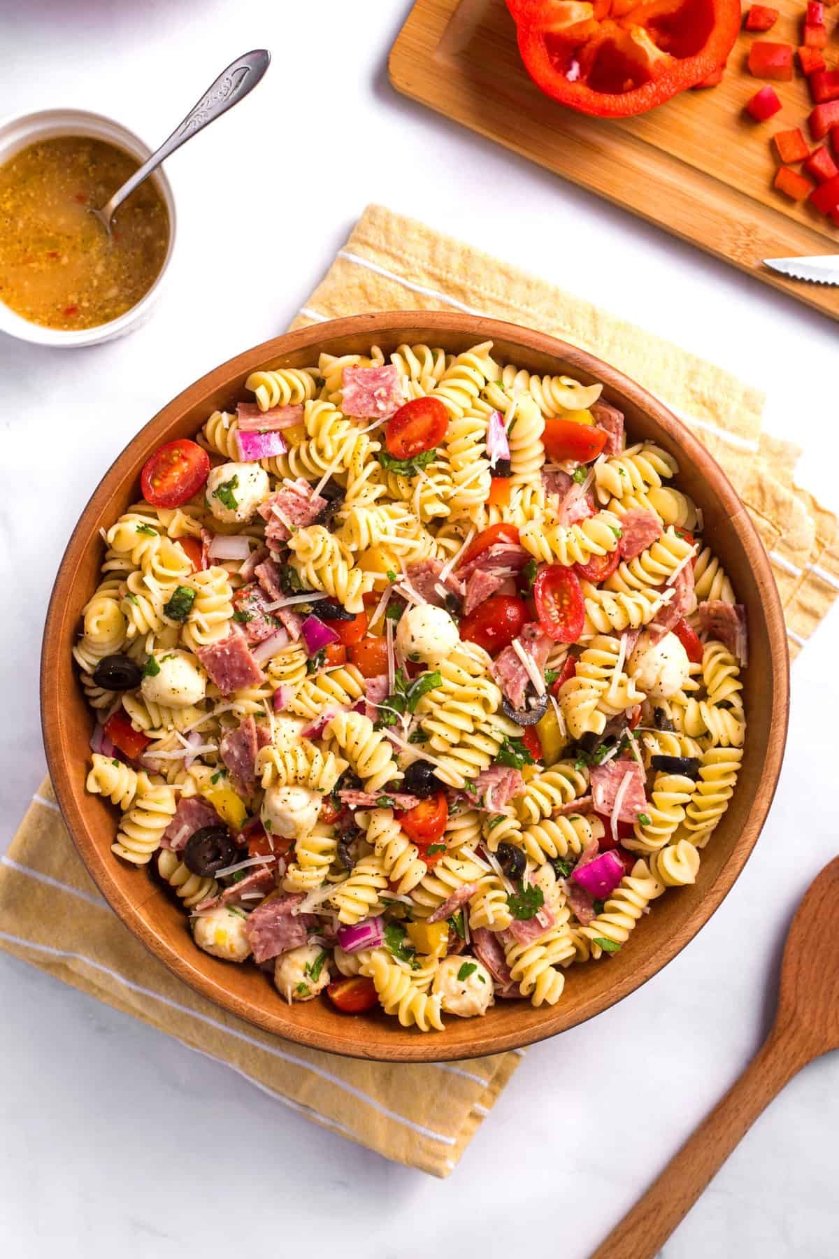 top down view of a wooden bowl of italian pasta salad