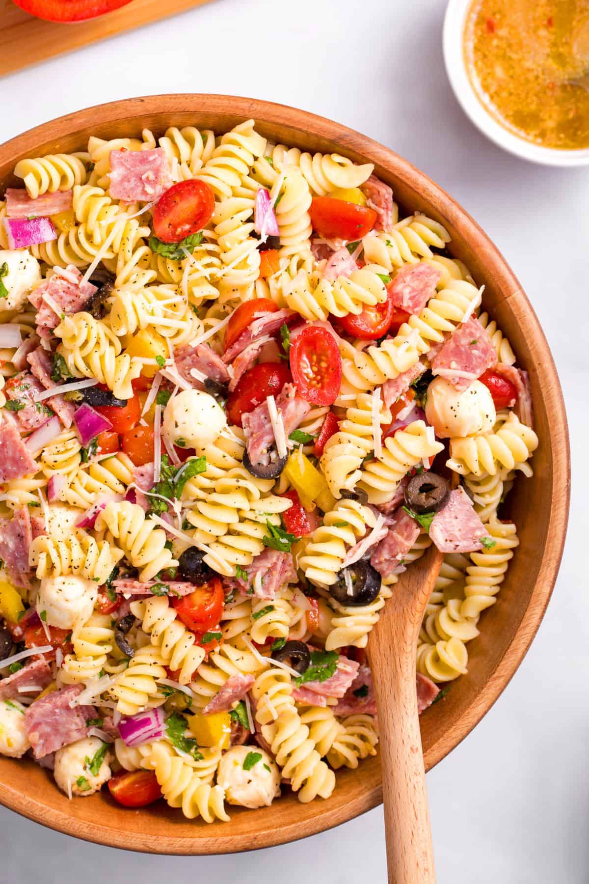 wooden bowl of italian pasta salad