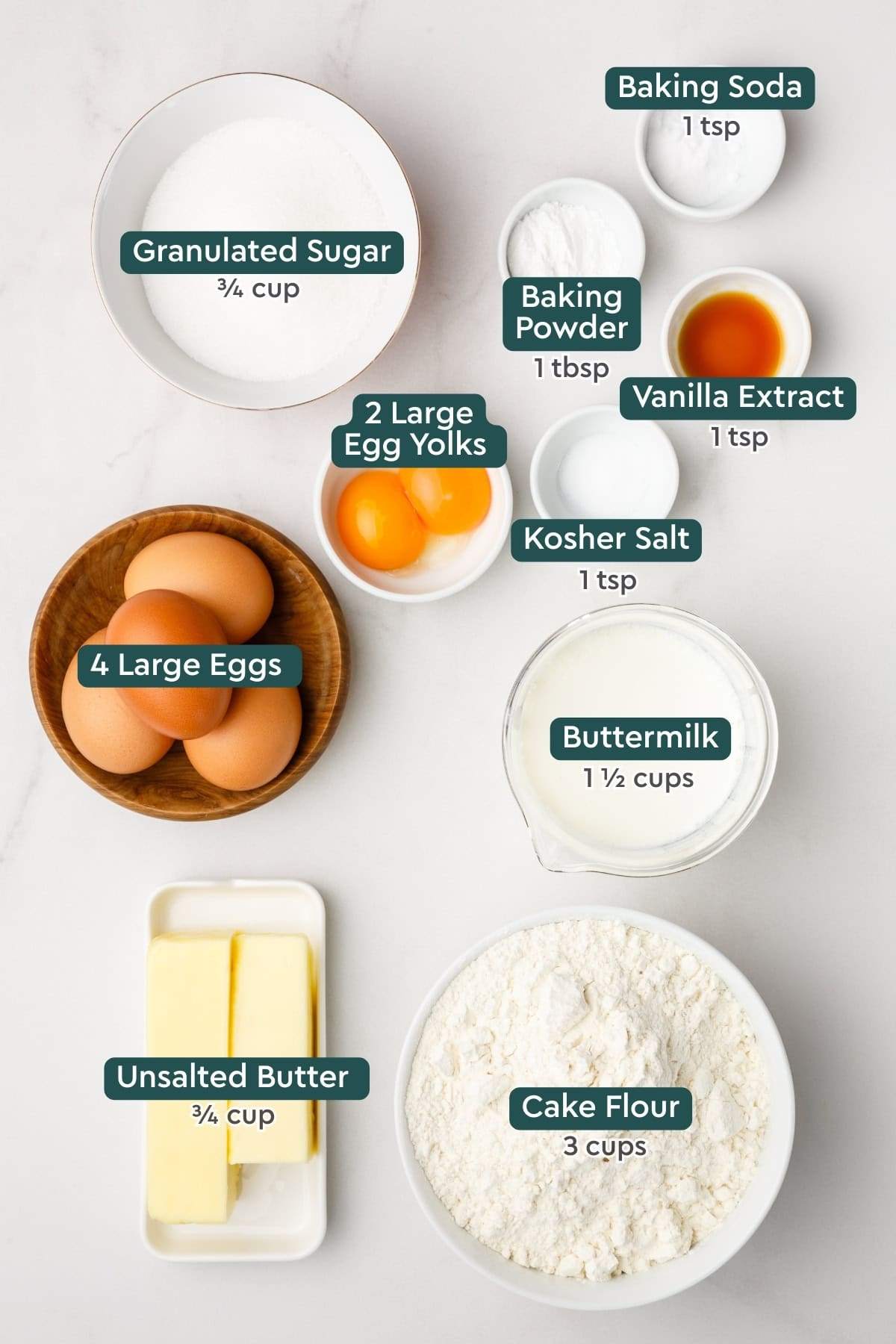 Ingredients for birthday cake from scratch, including sugar, baking soda & powder, vanilla, salt, eggs, buttermilk, butter, cake flour.