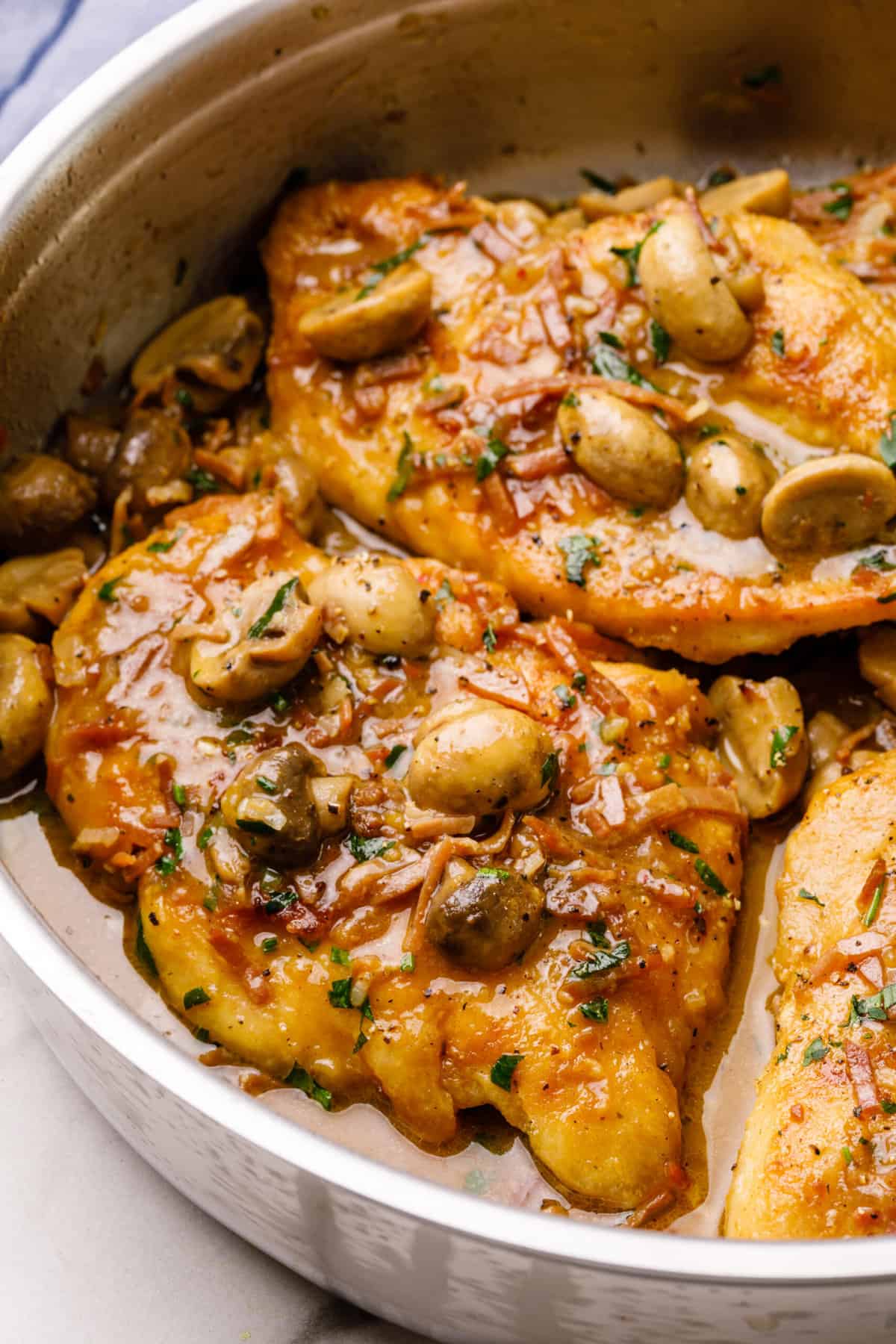 chicken marsala served in a stainless steel pan