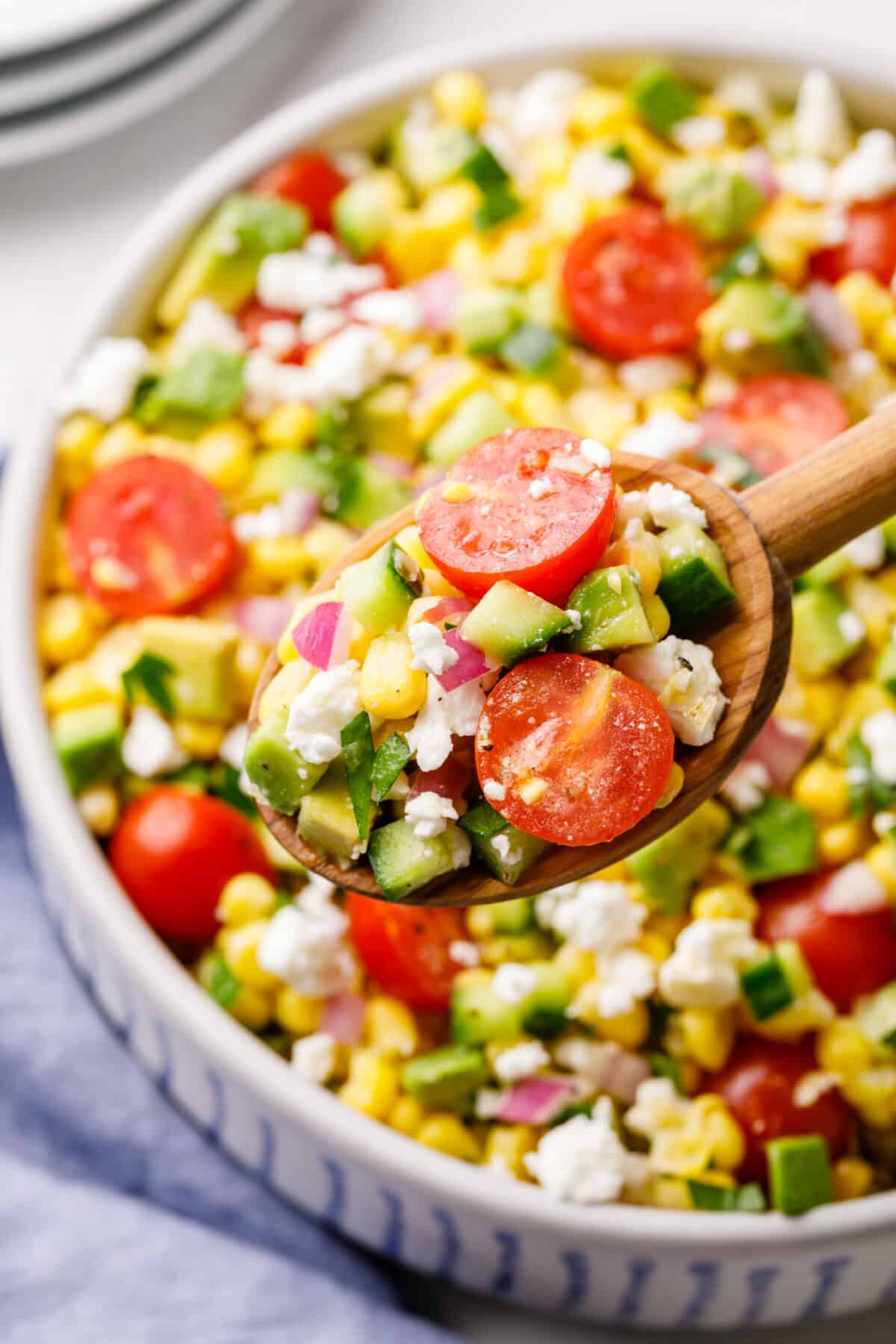 wooden spoonful of corn salad