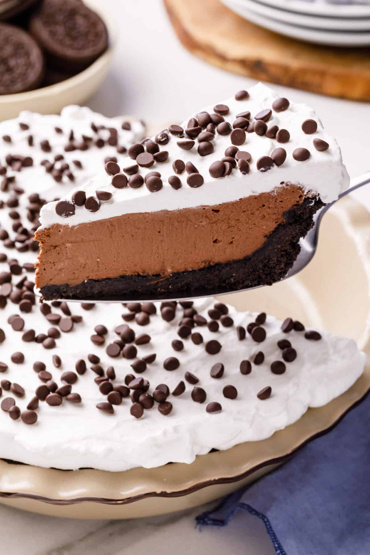 cross section slice of no bake chocolate cheesecake sitting on a metal spatula