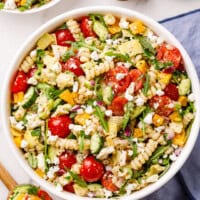 vegetables and pasta in a white bowl