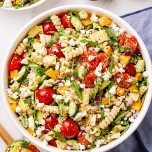 vegetables and pasta in a white bowl