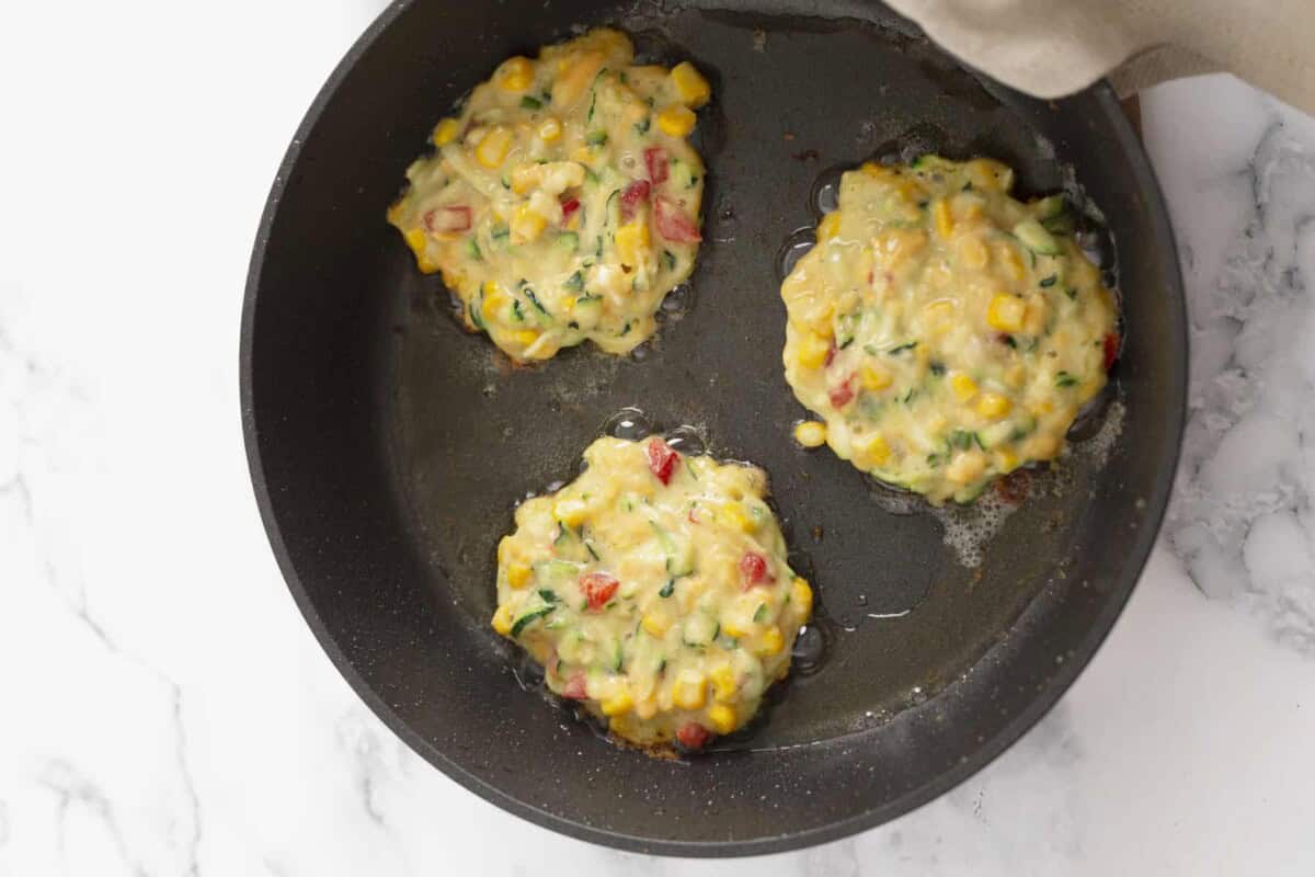 Zucchini corn fritter batter in pan.