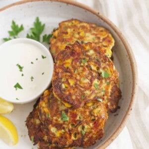 A plate of zucchini corn fritters.